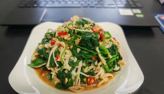 Spinach tossed with enoki mushrooms