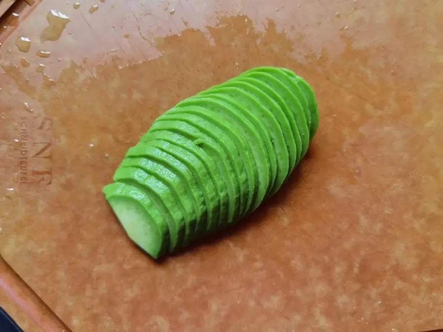 A replica of the restaurant's signature salad, salmon, !ï¸ avocado and nut salad step 0