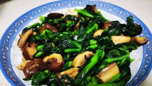 Home-cooked stir-fried greens with shiitake mushrooms