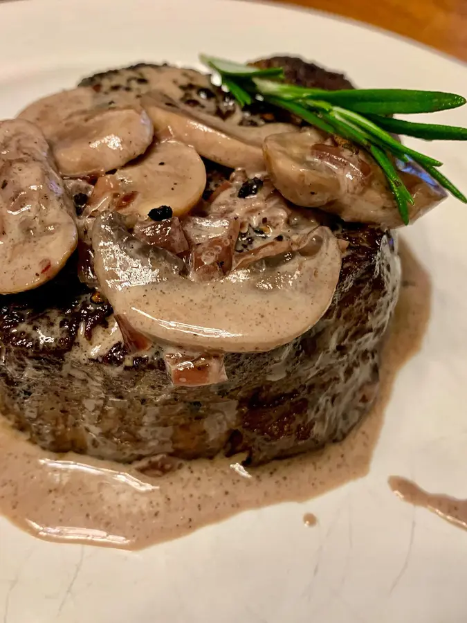 filet mignon service with red wine mushroom cream sauce