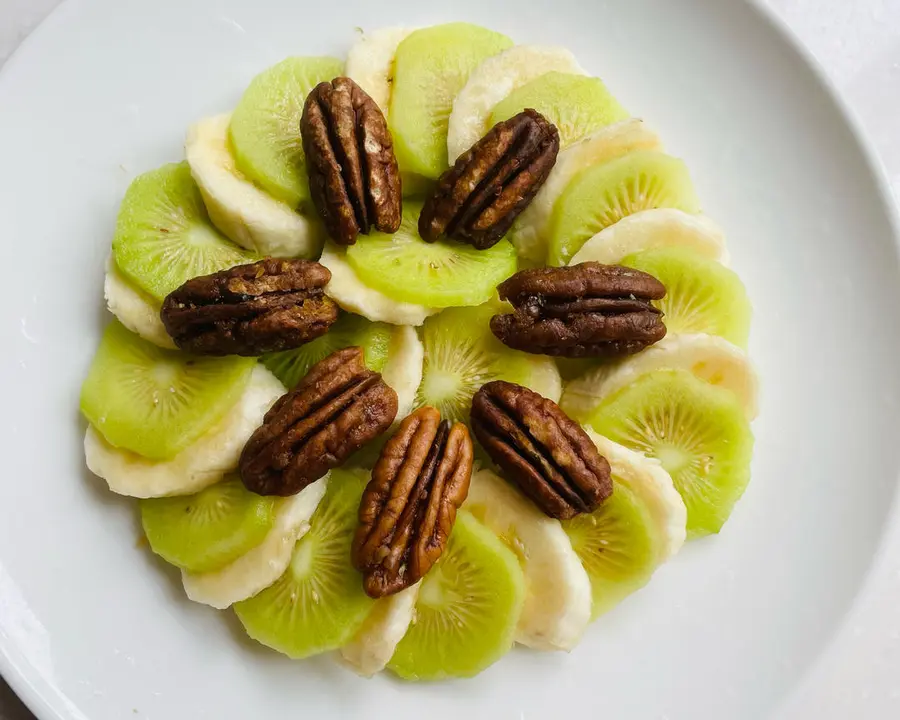 A creative platter of pecans and fruits step 0