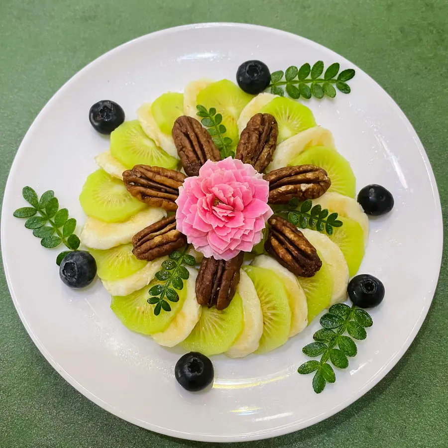 A creative platter of pecans and fruits step 0