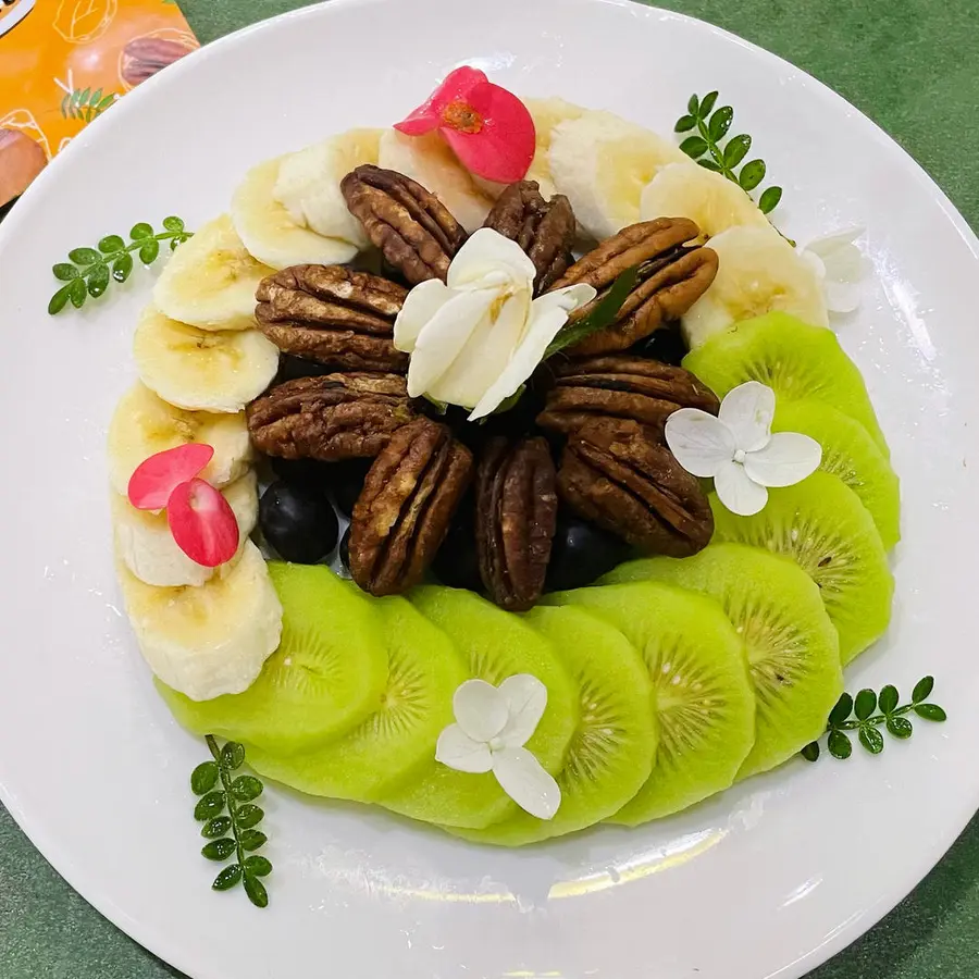 A creative platter of pecans and fruits step 0