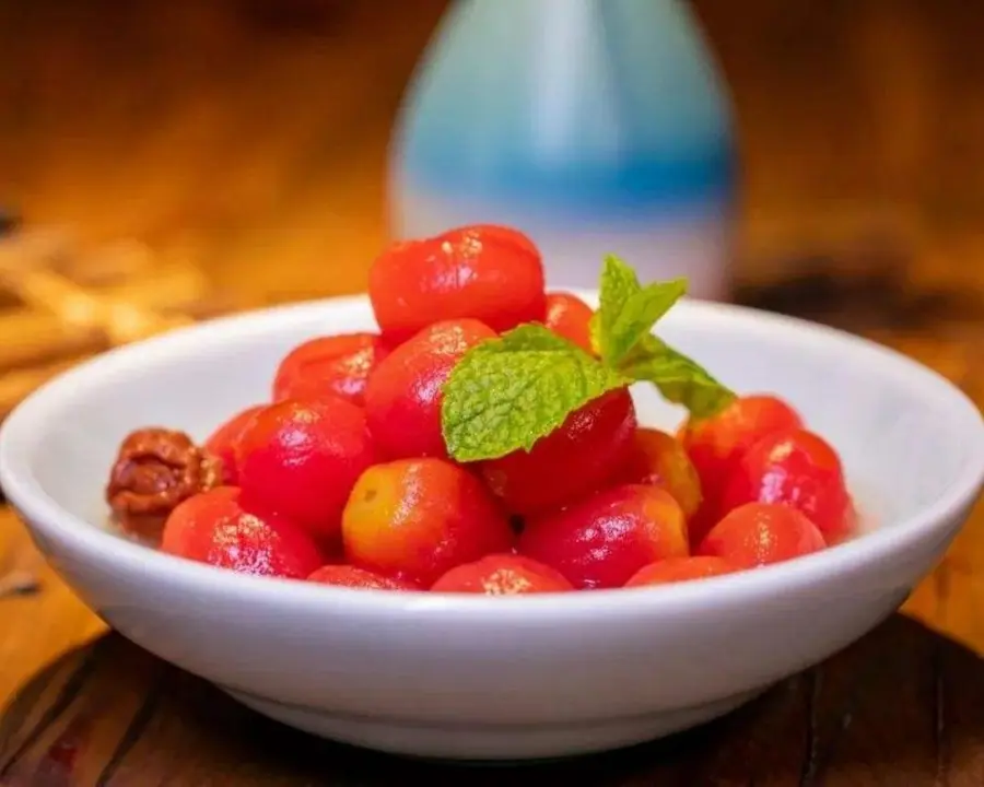 A small fresh plum and tomato in the Chinese New Year's Eve dinner