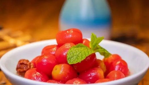 A small fresh plum and tomato in the Chinese New Year's Eve dinner